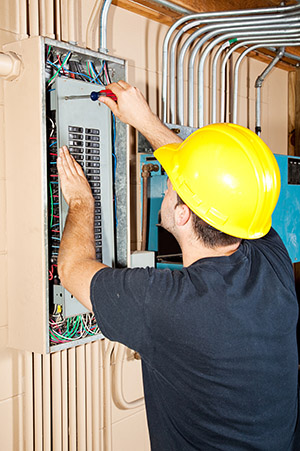 A Del Rio electrician performs an electrical panel repair.